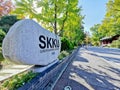 SEOUL, SOUTH KOREA - OCTOBER 24, 2022: Rock symbol sign of Sungkyunkwan University with students walk on the pavement