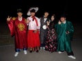 Group of young people dressed in hanbok, traditional Korean dress on a street in Seoul