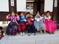 Six smiling children dressed in Hanbok, traditional Korean dress at Namsangol Hanok Village in Seoul