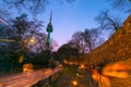 Seoul tower in seoul city at night view in spring with cherry blossom tree and old wall with light and people walking around, Royalty Free Stock Photo
