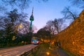 Seoul tower in seoul city at night view in spring with cherry blossom tree and old wall with light and people walking around, Royalty Free Stock Photo