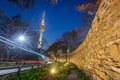 seoul tower in seoul city at night view in spring with cherry blossom tree and old wall with light and people walking around, Royalty Free Stock Photo