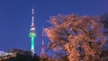 Seoul tower in seoul city at night view in spring with cherry blossom tree and old wall with light, south korea Royalty Free Stock Photo