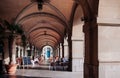 Street restaurant dinner table under arch arcade with sunlight i Royalty Free Stock Photo