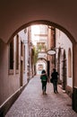 Small backstreet alley under arch arcade in old town Bern, Switz Royalty Free Stock Photo