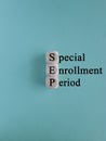 SEP special enrollment period symbol. Concept words SEP special enrollment period on wooden cubes