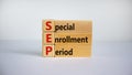 SEP, special enrollment period symbol. Wooden blocks with words `SEP, special enrollment period`. Beautiful white background, co