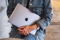 Sep 16th 2020 : A woman holding an Apple MacBook Pro laptop computer , Chiang mai Thailand