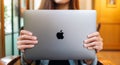 Sep 16th 2020 : A woman holding an Apple MacBook Pro laptop computer , Chiang mai Thailand