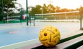 Sepak takraw ball on stand near court