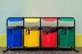 Separate collection of glass, metal, paper and plastic. Colored bins for separate garbage Royalty Free Stock Photo