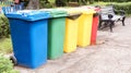Separate containers for garbage collection in the park. Multi-colored street trash cans on the street. Containers Selective