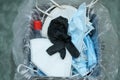 Separate garbage bin full of used protective face mask and gloves,covid19 medical disposal waste