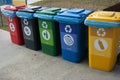 Separate garbage collection. Waste recycling concept. Containers for metal, glass, paper, organics, plastic for further processing Royalty Free Stock Photo