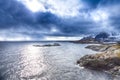 Separate Houses on Seashore Coastline in Norway Against Mountains