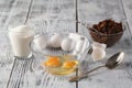 Separated egg white and yolks into two bowls and broken egg shells are at background Royalty Free Stock Photo