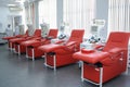 Separating apparatus and daybeds set at the City municipal blood transfusion station for taking blood, nurses standing on a