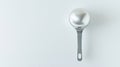 Separating Eggs Made Simple A Gleaming Silver Yolk Separator Spoon Against a Clean White Background Royalty Free Stock Photo