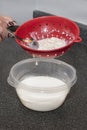 Separating Milk Kefir And Grains Royalty Free Stock Photo