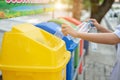 Separating waste plastic bottles into recycling bins is to protect the environment, causing no pollution, reduce global warming, Royalty Free Stock Photo