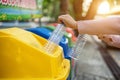 Separating waste plastic bottles into recycling bins is to protect the environment, causing no pollution, reduce global warming, Royalty Free Stock Photo