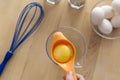 Separating yellow yolks from protein in raw eggs for cake, biscuit and cream. Royalty Free Stock Photo