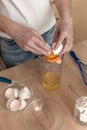 Separating yellow yolks from protein in raw eggs for cake, biscuit and cream. Royalty Free Stock Photo