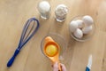 Separating yellow yolks from protein in raw eggs for cake, biscuit and cream. Royalty Free Stock Photo