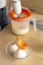 Separating yellow yolks from protein in raw eggs for cake, biscuit and cream. Step 6 Royalty Free Stock Photo