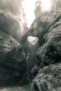 Sepia color photo of beautiful crystal clear water cave with waterfall in the middle of the tropical jungle of Costa Rica Royalty Free Stock Photo