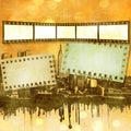 Sepia film strip background on dripping city skyline