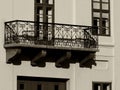 Decorative old stone balcony in low level view on multi level classic white building Royalty Free Stock Photo