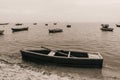 Sepia shot of boats floating in the sea