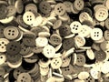 Sepia tone disorderly small sewing buttons background