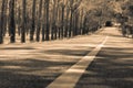 Sepia tone lonely road, center line and bright future. Dreamy l Royalty Free Stock Photo