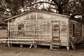 Sepia Toned Old House with Boarded up Door