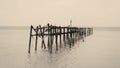 A Sepia toned photo of an old wooden jetty at Bophut beach in Koh Samui, Thailand. Royalty Free Stock Photo