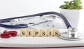 SEPSIS word made with building blocks, medical concept background