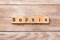 Sepsis word written on wood block. Sepsis text on wooden table for your desing, concept