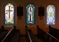 Beautiful stained glass windows grace the interior of the Saint Elizabeth of Hungary Catholic Church in Eureka Springs, Arkansas Royalty Free Stock Photo