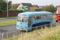 A small convoy of Vintage coaches returning from a fun day out via the dual carriageway in Bangor after a day at a local fair Royalty Free Stock Photo