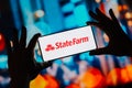 September 3, 2023, Brazil. In this photo illustration, the State Farm Insurance logo is displayed on a smartphone screen