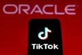 September 21, 2020, Brazil. In this photo illustration a TikTok logo is seen displayed on a smartphone with an Oracle logo on the Royalty Free Stock Photo