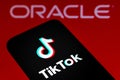 September 21, 2020, Brazil. In this photo illustration a TikTok logo is seen displayed on a smartphone with an Oracle logo on the Royalty Free Stock Photo