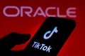 September 21, 2020, Brazil. In this photo illustration a TikTok logo is seen displayed on a smartphone with an Oracle logo on the Royalty Free Stock Photo