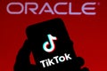 September 21, 2020, Brazil. In this photo illustration a TikTok logo is seen displayed on a smartphone with an Oracle logo on the Royalty Free Stock Photo