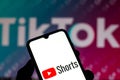 September 21, 2020, Brazil. In this photo illustration a YouTube Shorts logo is seen displayed on a smartphone with an TikTok logo Royalty Free Stock Photo