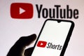 September 21, 2020, Brazil. In this photo illustration a YouTube Shorts logo is seen displayed on a smartphone with an YouTube Royalty Free Stock Photo