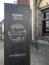 The entrance sign in stone at the gate of the wildlife park Pairi Daiza