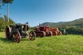 Three tractors plowing a field